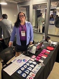 Jennifer Schell, CEO and Creator of Finliti, presenting Game of Gains at an event